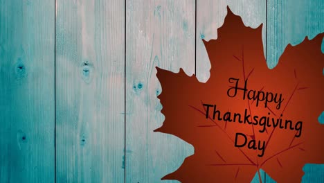 Animation-of-happy-thanksgiving-day-text-over-leaf