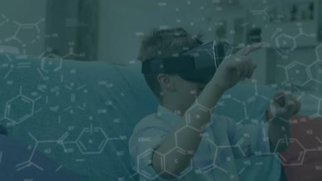 Animation-of-chemical-equations-over-caucasian-boy-using-vr-headset