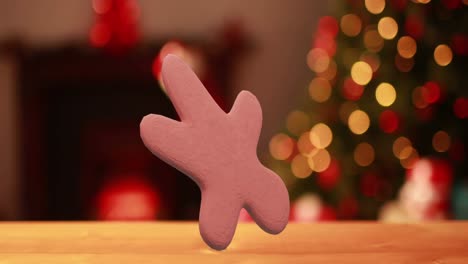 Animation-of-christmas-gingerbread-cookie-over-flickering-christmas-fairy-lights