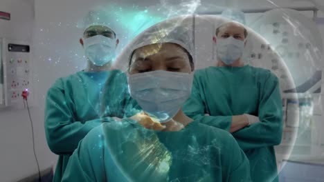 Animation-of-globe-over-diverse-surgeons-with-face-masks