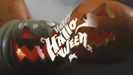 Animation-Von-Halloween-Text-über-Geschnitzten-Kürbissen-Auf-Grauem-Hintergrund