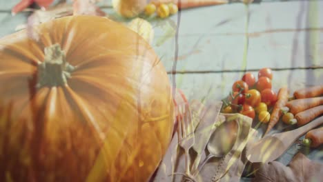 Animation-of-halloween-pumpkin-and-autumn-produce-on-grey-background