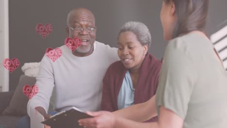 Animation-of-hearts-over-senior-african-american-couple-with-asian-woman-talking