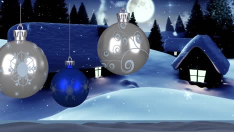 Animation-of-baubles-and-snow-falling-over-winter-landscape