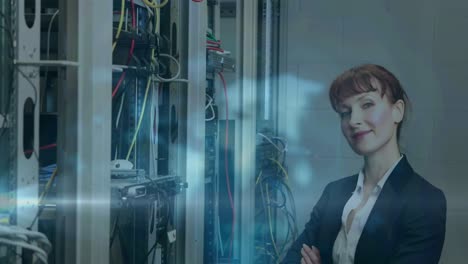 Animation-of-light-trails-over-caucasian-female-worker-in-server-room
