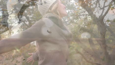 Animation-of-shapes-and-leaves-falling-over-caucasian-woman-in-park