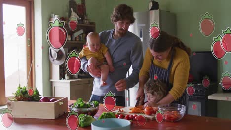Animation-of-strawberry-icons-over-caucasian-family-cooking