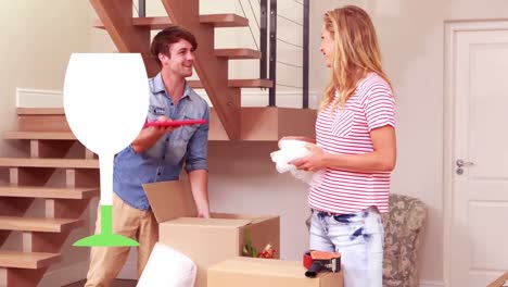 Animation-of-wine-glass-over-happy-caucasian-couple-moving-into-new-house