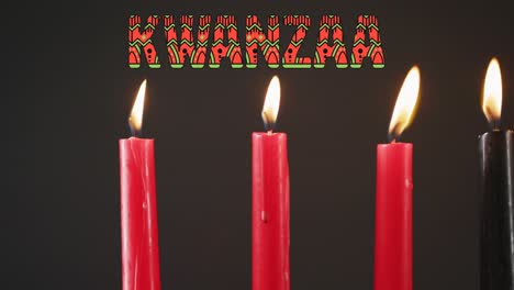 Animation-of-kwanzaa-text-candles-over-black-background