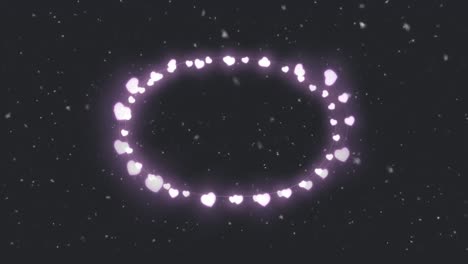 Animation-of-heart-frame-over-snow-falling