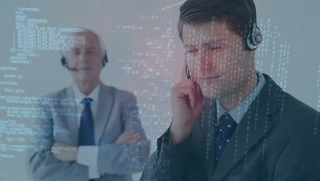 Animation-of-data-processing-over-two-male-customer-care-executives-talking-on-phone-headset