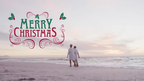Animation-of-merry-christmas-text-over-senior-caucasian-couple-at-beach