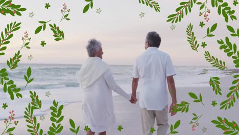 Animation-of-leaves-over-senior-biracial-couple-at-beach