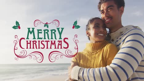 Animation-of-merry-christmas-text-over-biracial-couple-at-beach