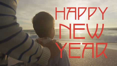 Animation-of-happy-new-year-text-over-biracial-man-and-his-son-at-beach