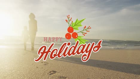 Animation-of-happy-holidays-text-over-biracial-mother-and-daughter-at-beach