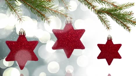 Animation-of-spots-moving-over-christmas-decorations