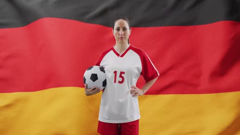 Animation-of-caucasian-female-soccer-player-over-flag-of-germany