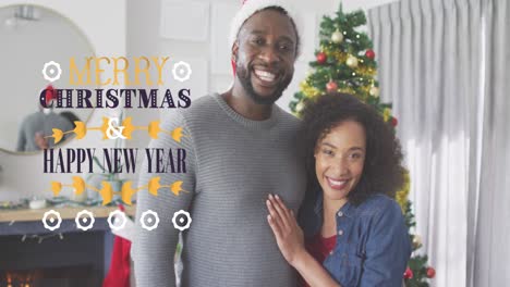 Animation-of-merry-christmas-text-over-african-american-couple-smiling