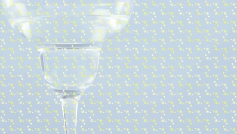 Animation-of-shapes-over-drink-in-glass-on-white-background