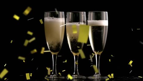Animation-of-falling-golden-confetti-over-glasses-filled-with-champagne-against-black-background