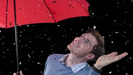 Animation-Von-Konfetti,-Die-über-Einen-Kaukasischen-Mann-Mit-Regenschirm-Auf-Schwarzem-Hintergrund-Fällt