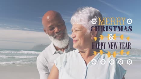 Animation-of-merry-christmas-and-new-year-text-over-diverse-senior-couple-laughing-on-sunny-beach