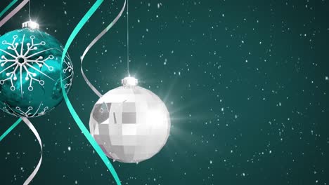 Animation-of-blue-and-silver-streamers-and-christmas-baubles,-with-falling-snow-on-dark-background