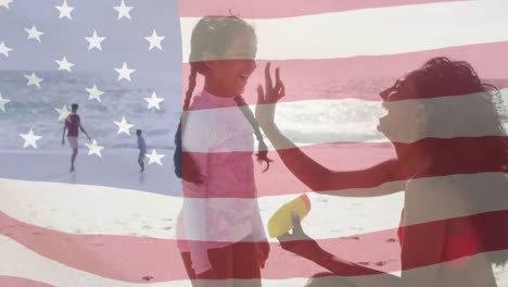 Animation-of-flag-of-united-states-of-america-over-biracial-couple-with-children-by-seaside