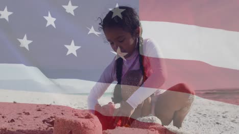 Animation-Der-Flagge-Der-Vereinigten-Staaten-Von-Amerika-über-Ein-Gemischtrassiges-Mädchen,-Das-Am-Strand-Mit-Sand-Spielt