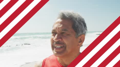 Animation-of-flag-of-united-states-of-america-over-senior-biracial-man-on-beach