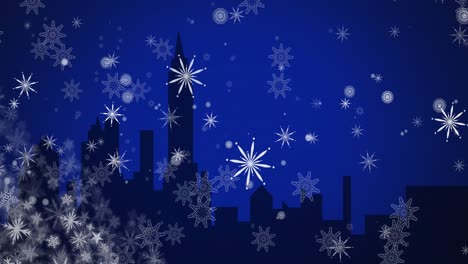 Animation-of-falling-white-christmas-snowflakes-over-blue-night-sky-and-cityscape-silhouette