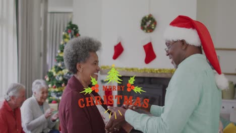 Animation-of-merry-christmas-over-happy-african-american-senior-couple-dancing-in-santa-hats