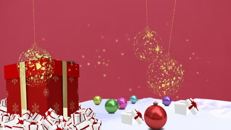Animation-of-gold-christmas-baubles-and-stars-over-gift-and-decorations-on-pink-background