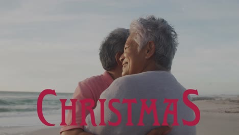 Animation-of-christmas-over-happy-senior-hispanic-couple-on-beach