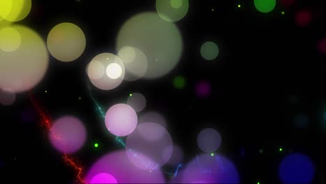 Animation-of-colourful-christmas-light-spots-and-lights-trails-on-black-background