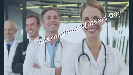 Animation-of-international-workers-day-text-over-diverse-doctors-smiling
