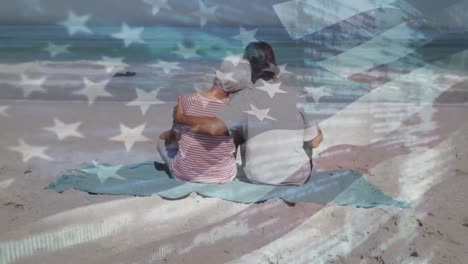 Animation-of-flag-of-united-states-of-america-over-senior-caucasian-couple-embracing-on-beach