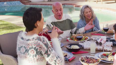 Happy-caucasian-family-having-dinner-in-garden