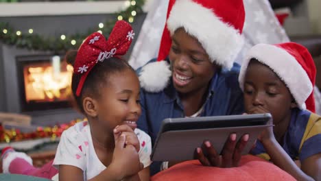 Happy-african-american-mother-with-children-using-tablet