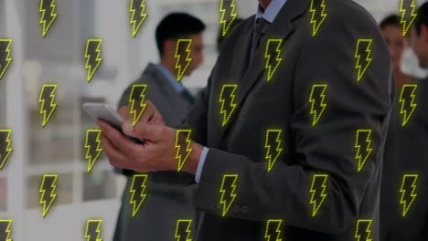 Animation-of-flash-pattern-moving-over-caucasian-businessman-using-smartphone