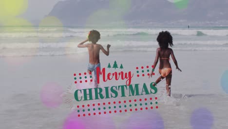 Animation-of-merry-christmas-over-happy-african-american-children-on-beach