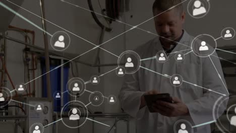 Animation-of-network-of-connections-with-icons-over-caucasian-male-doctor