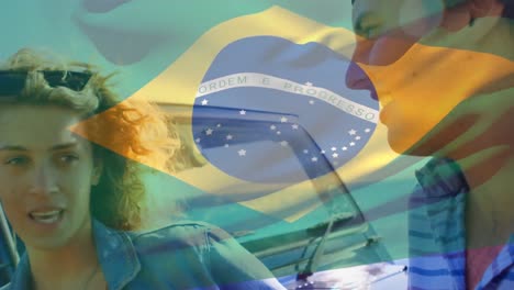 Animation-of-flag-of-brazil-over-caucasian-couple-talking