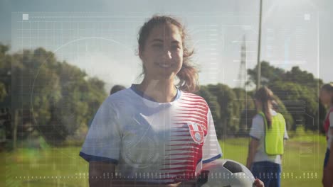 Animation-of-data-processing-over-caucasian-female-soccer-player-holding-soccer-ball-smiling