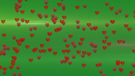 Animation-of-falling-red-hearts-over-green-background