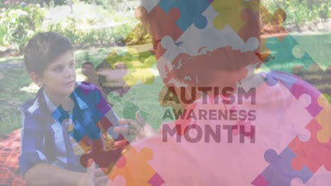 Animation-of-puzzle-and-autism-awareness-month-text-over-caucasian-boy-talking-with-teacher