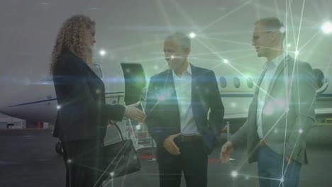 Animation-of-network-of-connections-over-caucasian-business-people-at-airport