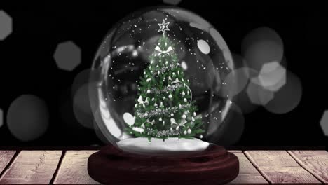 Animation-of-christmas-snow-globe-with-christmas-tree-on-black-background