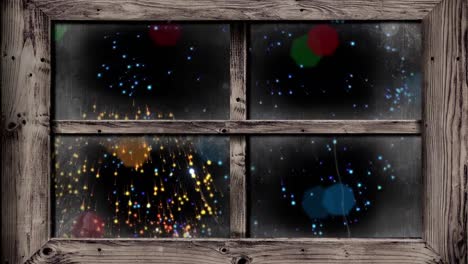 Animation-of-snow-falling-over-christmas-fairy-lights-flickering-and-fireworks-in-winter-window